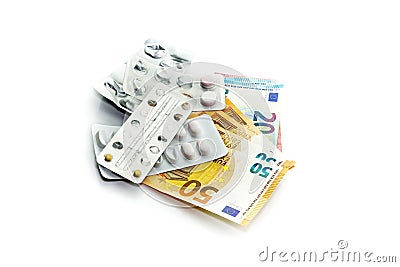 Pills and euros on a white background close-up. Stock Photo