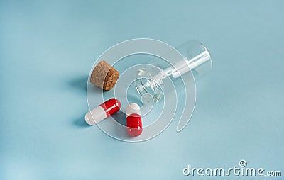 Pills in a glass jar on a light background close-up. medical preparations. vitamins. empty pill jars. chemical production Stock Photo