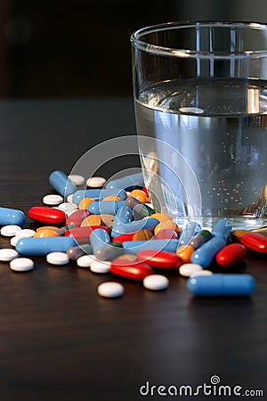 Pills and glass of water Stock Photo