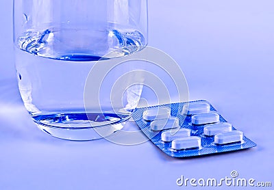 Pills and Glass of Water Stock Photo