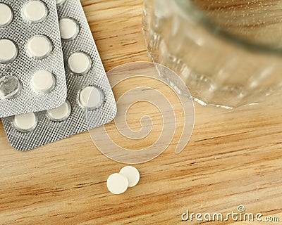 Pills and glass of water Stock Photo