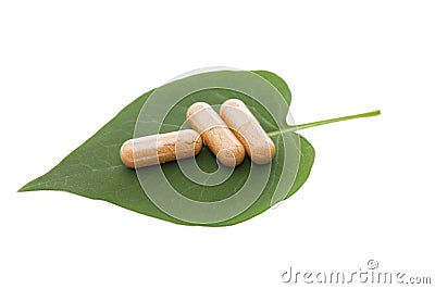 Pills on green sheet Stock Photo