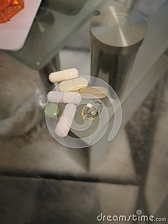 pills laying on a glas table Stock Photo