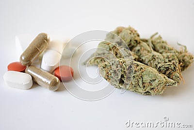 Pills and Marijuana Stock Photo