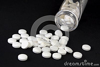 Pills and medicine container Stock Photo