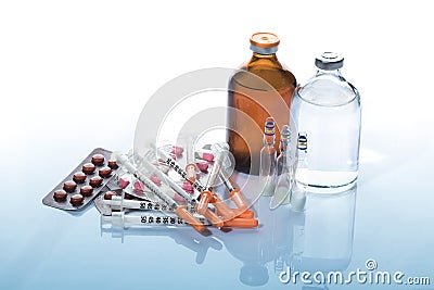 Pills and medicine Vials with syringe. Stock Photo