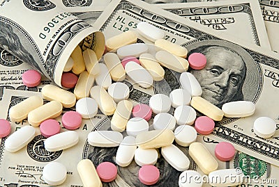 Pills and money Stock Photo