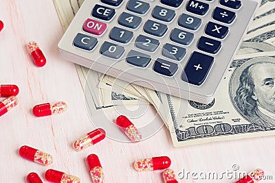 Pills, Money and calculator Stock Photo