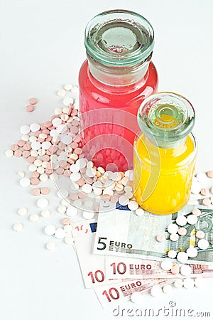 Pills and money, concept Stock Photo