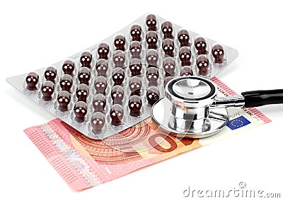 Pills, money and a stethoscope Stock Photo