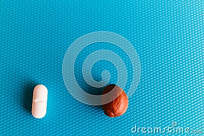Pills or nuts, your choice, nuts are useful or harmful pills. How to cure Stock Photo