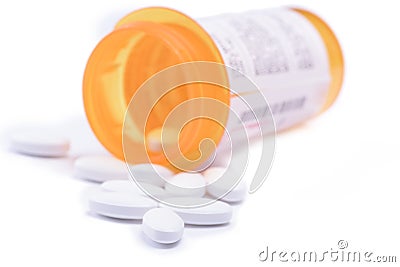 Pills out of pill bottle on white background Stock Photo