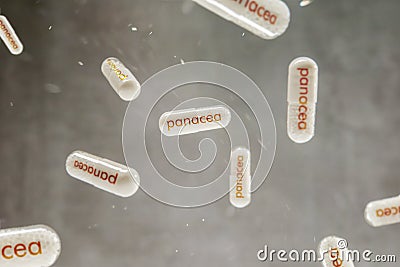 Pills with `panacea` sign hangs on the grey background Stock Photo