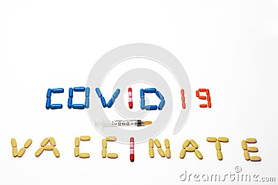 Pills spelling and emphasizing the Coronavirus Vaccination during Covid 19 with Copy Space Stock Photo