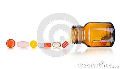 Pills spilling out of pill bottle Stock Photo