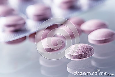 Pills Tablets Capsule or Medicament freely laid on glass background Stock Photo