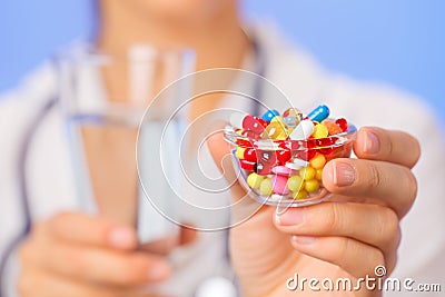 Pills, tablets and drugs heap in doctor hand Stock Photo