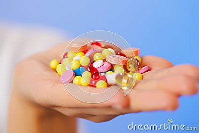 Pills, tablets and drugs heap in doctor's hand Stock Photo