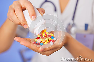 Pills, tablets and drugs pouring from bottle Stock Photo