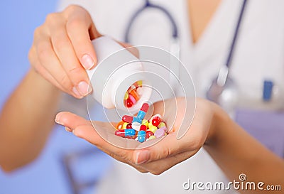 Pills, tablets and drugs pouring from bottle Stock Photo