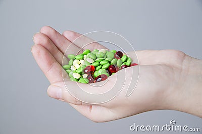 Pills in women hand Stock Photo