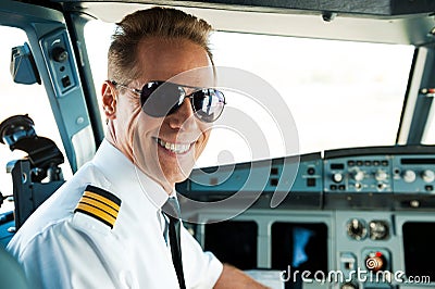 Pilot in cockpit. Stock Photo