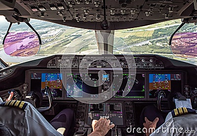 Pilot and copilot in commercial plane Stock Photo