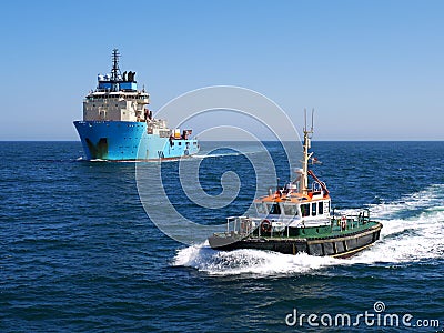 Pilot Cutter Escorting Offshore Vessel. Stock Photo