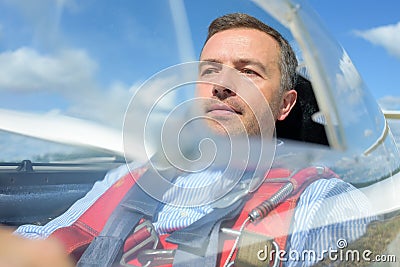 Pilot in glider cockpit Stock Photo