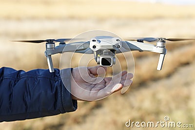 Pilot hand launching drone drone ready to take off. modern unmanned technologies. delivery of parcels by drones by air Stock Photo