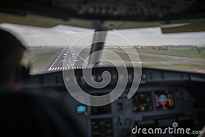 Pilot`s hand accelerating on the throttle in airplane flight cockpit during takeoff Stock Photo