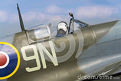 Pilot sits in cockpit of Supermarine Spitfire british fighter aircraft Editorial Stock Photo