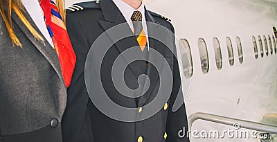 Pilot and stewardess. Stock Photo