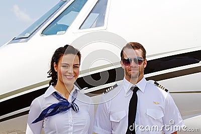 Pilot and stewardess ready for passengers Stock Photo