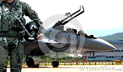 Pilot walking away from jet fighter Stock Photo