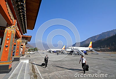 Pilots with baggage walking in Paro airport after landing Editorial Stock Photo