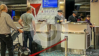 Pilots in a Delta gate preparing to fly out to their destination at the Orlando International Airport Editorial Stock Photo