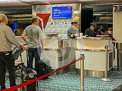 Pilots in a Delta gate preparing to fly out to their destination at the Orlando International Airport Editorial Stock Photo