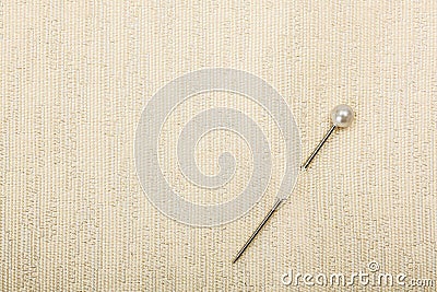 Pin inserted in fabric Stock Photo