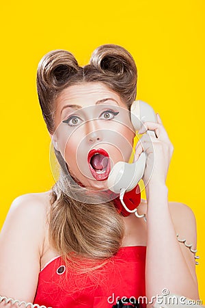 Pin-up girl talking on retro telephone Stock Photo