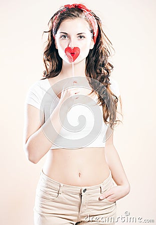 Pin up girl, valentine lollipop in shape of heart Stock Photo