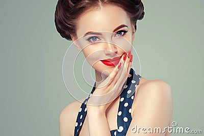 Pin up girl vintage. Beautiful woman pinup style portrait in retro dress and makeup, manicure nails hands, red lipstick and polka Stock Photo