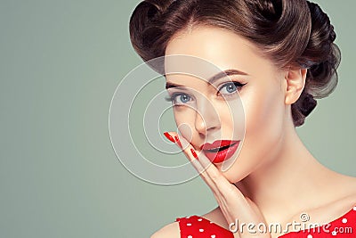 Pin up girl vintage. Beautiful woman pinup style portrait in retro dress and makeup, manicure nails hands, red lipstick and polka Stock Photo