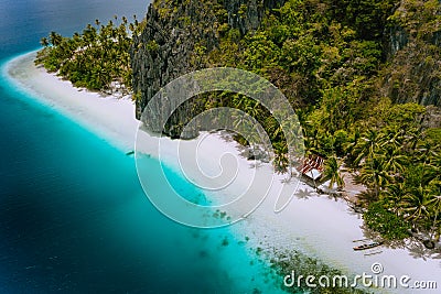 Pinagbuyutan Island, El Nido, Palawan, Philippines. Aerial drone photo of tropical hut surrounded by rocks, white sandy Stock Photo