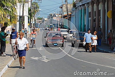 People move by the street in downtown in Pinar del Rio, Cuba. Editorial Stock Photo