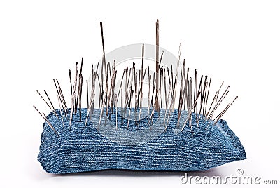 Pincushion with lot of needles Stock Photo