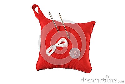 Pincushion, needle, thread and button Stock Photo