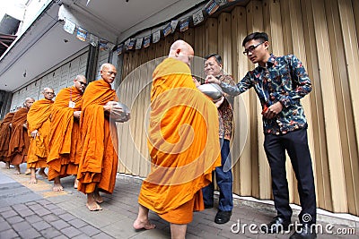 Pindapata - Monks Collecting the food from Buddhist peoples Vesak Day Editorial Stock Photo