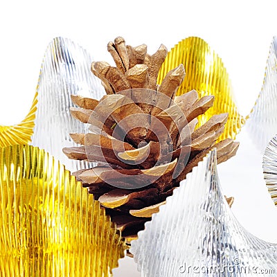 Pine cone and golden and silver garland Stock Photo