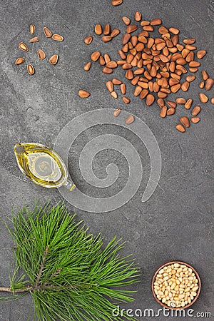 Pine nuts, pine nut oil and cedar branch Stock Photo